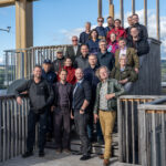 A group of people standing on a staircase for a group photo